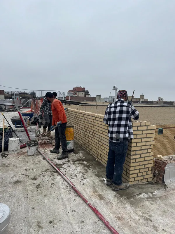 Brick wall repointing and restoration work on a Bronx building