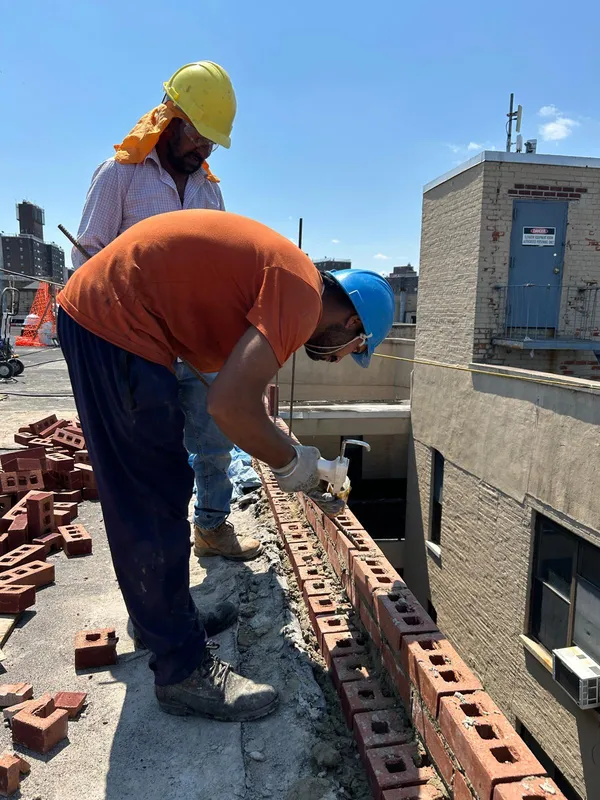 Doon Construction contractor inspecting a rooftop in the Bronx