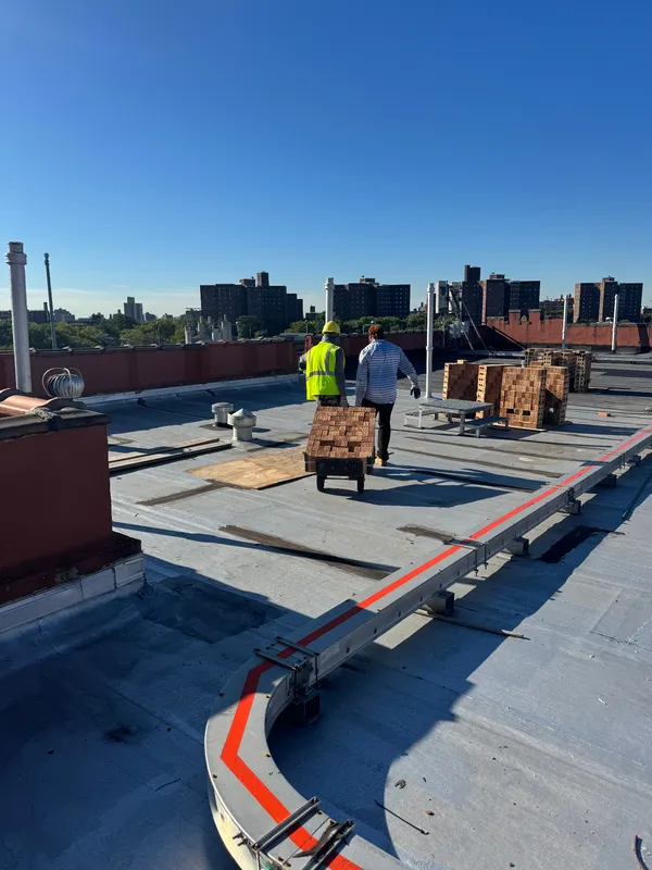 Completed rooftop work with panoramic Bronx city view