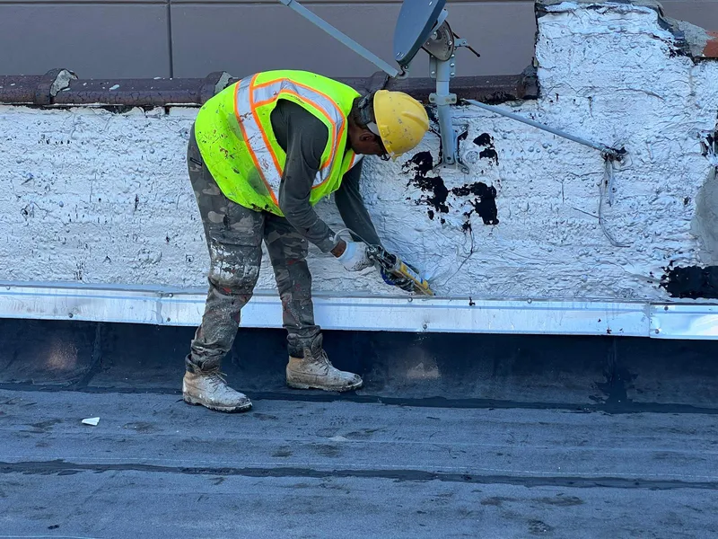 Flat roof replacement in progress on a Bronx apartment building